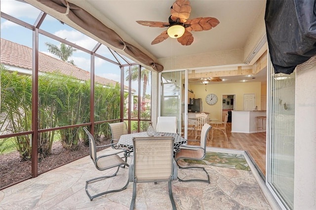 sunroom / solarium with ceiling fan