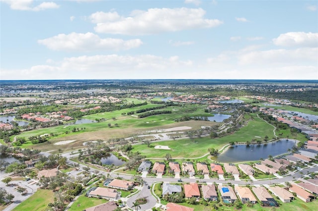 birds eye view of property with a residential view, view of golf course, and a water view