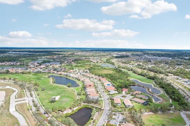 aerial view with view of golf course and a water view