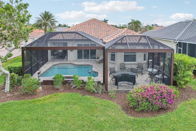 rear view of house with an outdoor pool, glass enclosure, a tile roof, an outdoor hangout area, and a patio area