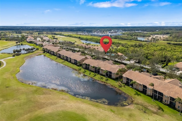 drone / aerial view featuring a residential view and a water view