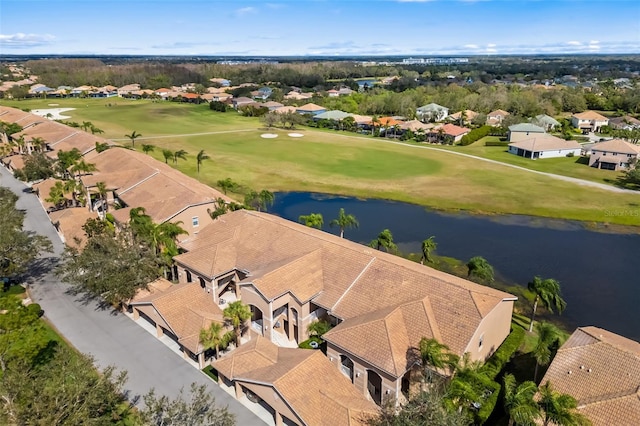 aerial view featuring a residential view, view of golf course, and a water view