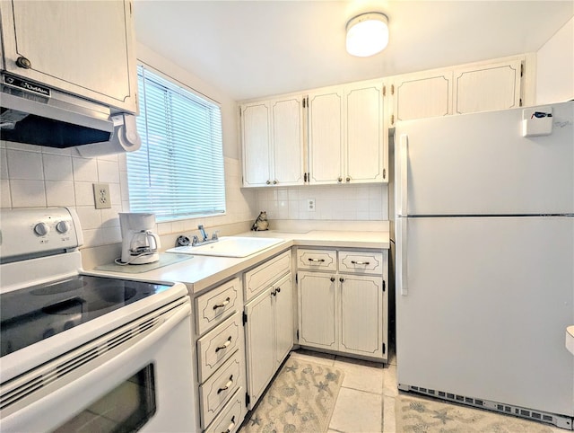 kitchen featuring extractor fan, white appliances, a sink, light countertops, and backsplash