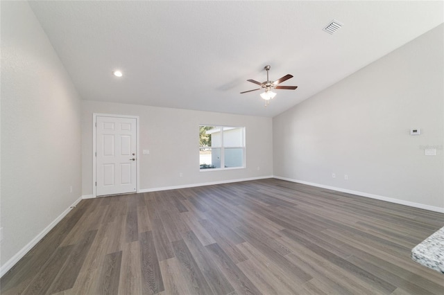 unfurnished living room with baseboards, visible vents, a ceiling fan, lofted ceiling, and dark wood-style flooring