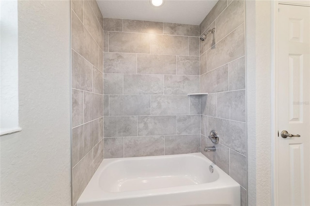 bathroom with washtub / shower combination