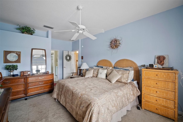 bedroom featuring a ceiling fan, light carpet, and visible vents