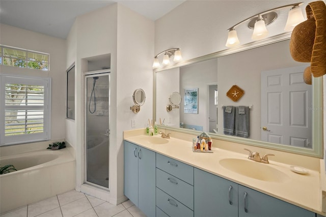 full bath featuring tile patterned flooring, a sink, a shower stall, and a bath