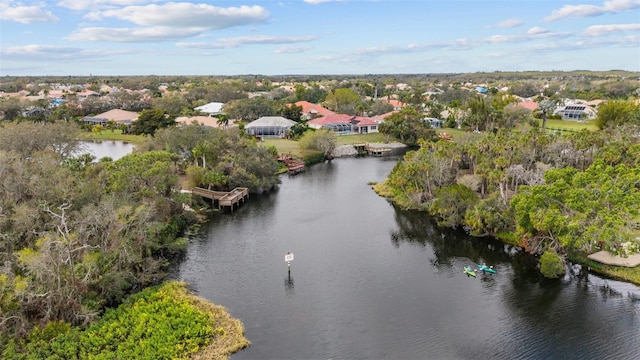 birds eye view of property featuring a water view and a residential view