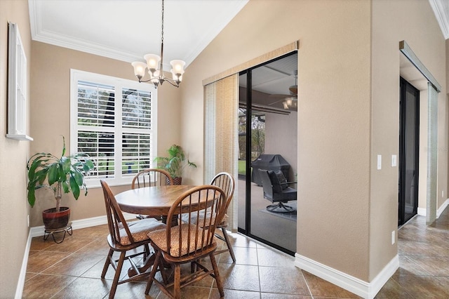 dining room featuring baseboards, ornamental molding, and a notable chandelier