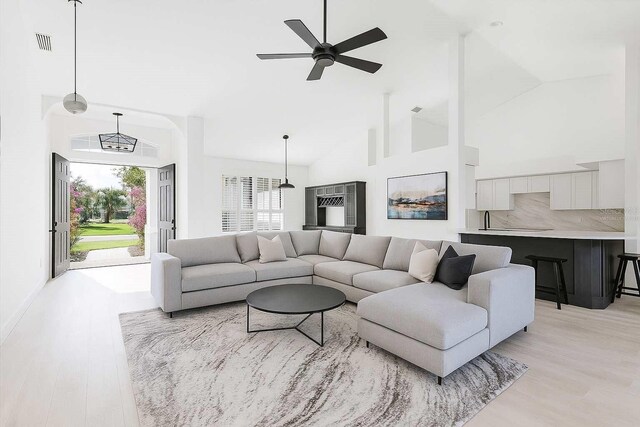 6211 90th Avenue Cir E, Parrish, FL 34219 - living room with ceiling fan, light wood finished floors, and high vaulted ceiling