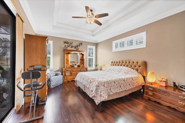 6211 90th Avenue Cir E, Parrish, FL 34219 - bedroom with a tray ceiling, dark wood-type flooring, ornamental molding, and a ceiling fan