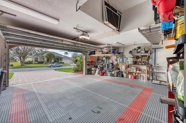 6211 90th Avenue Cir E, Parrish, FL 34219 - garage featuring a garage door opener