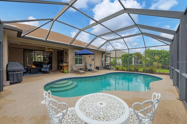 6211 90th Avenue Cir E, Parrish, FL 34219 - outdoor pool featuring a patio area, grilling area, and a lanai