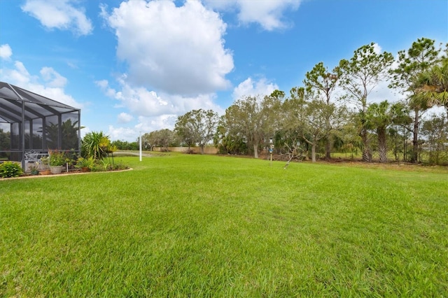 6211 90th Avenue Cir E, Parrish, FL 34219 - view of grassy yard featuring a lanai