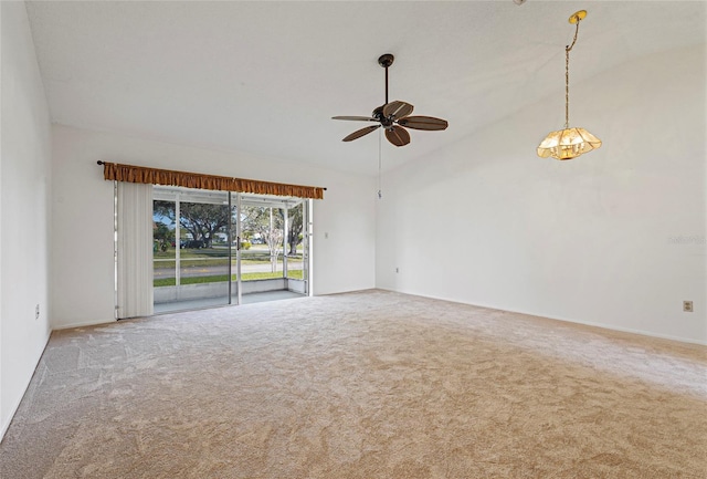 spare room featuring high vaulted ceiling, carpet flooring, and a ceiling fan