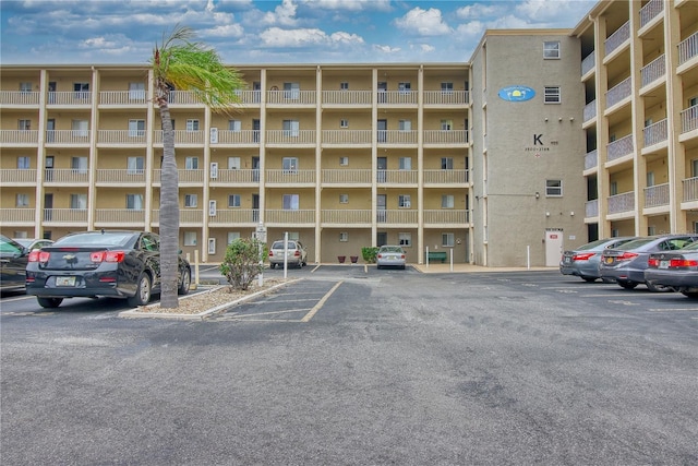 view of property with uncovered parking