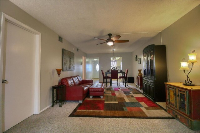3658 Lake Bayshore Dr Unit 320, Bradenton, FL 34205 - carpeted living room featuring ceiling fan, visible vents, and a textured ceiling