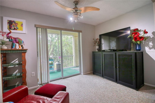 3658 Lake Bayshore Dr Unit 320, Bradenton, FL 34205 - living area featuring carpet flooring, a ceiling fan, and baseboards