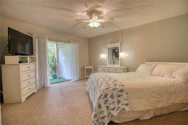 3658 Lake Bayshore Dr Unit 320, Bradenton, FL 34205 - bedroom with a ceiling fan, access to outside, light carpet, and a textured ceiling