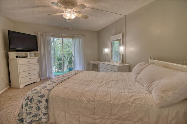 3658 Lake Bayshore Dr Unit 320, Bradenton, FL 34205 - bedroom with a ceiling fan, light carpet, a textured ceiling, access to outside, and baseboards