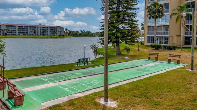 3658 Lake Bayshore Dr Unit 320, Bradenton, FL 34205 - view of community with shuffleboard, a lawn, and a water view