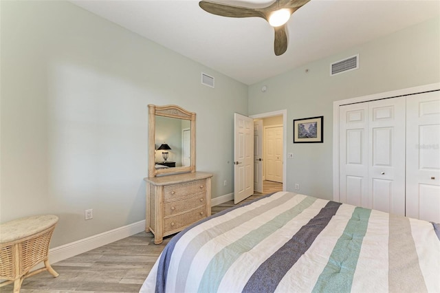 5591 Cannes Cir Unit 403, Sarasota, FL 34231 - bedroom with light wood-type flooring, a closet, baseboards, and ceiling fan