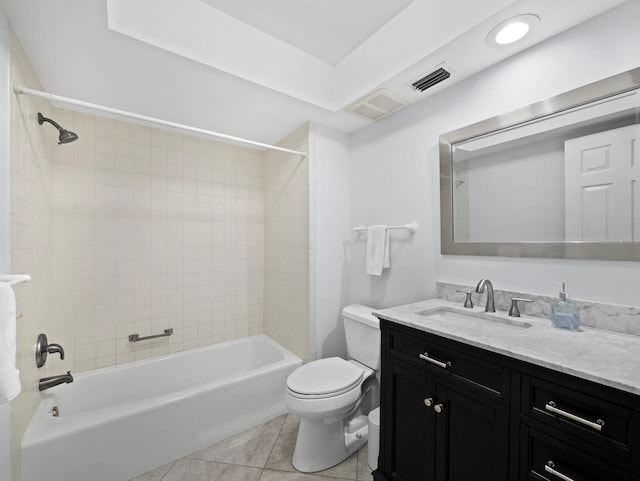 bathroom featuring visible vents, toilet, tub / shower combination, vanity, and tile patterned flooring