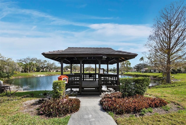 view of dock featuring a water view and a gazebo