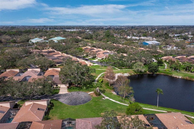 drone / aerial view with a water view and a residential view