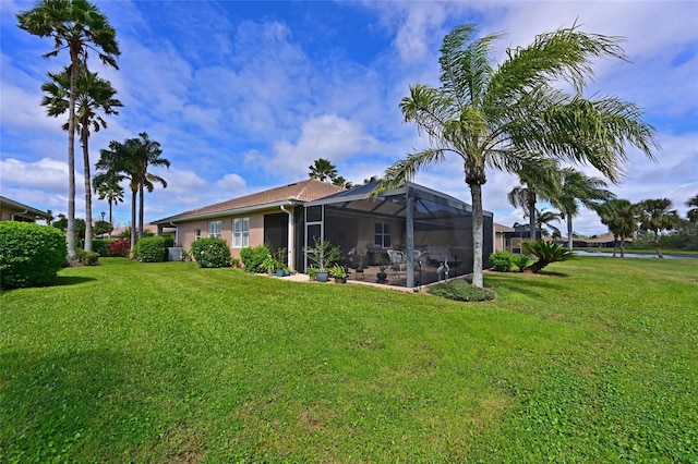 view of yard with glass enclosure