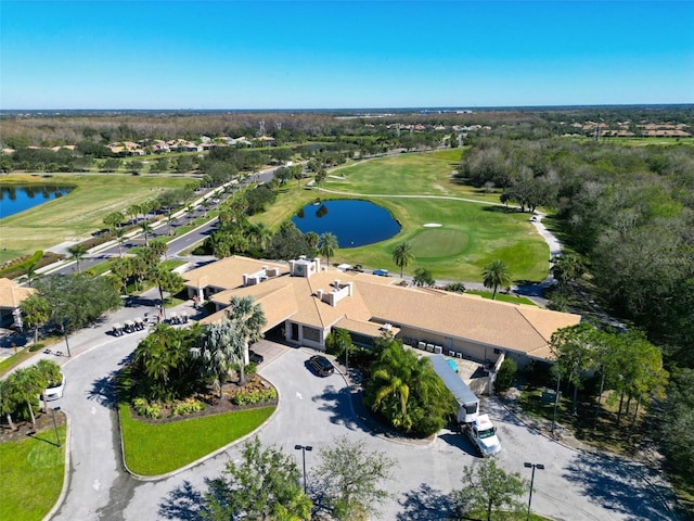 bird's eye view with view of golf course and a water view