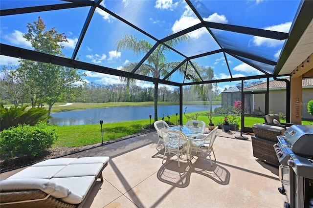 view of patio / terrace with grilling area, a water view, and a lanai