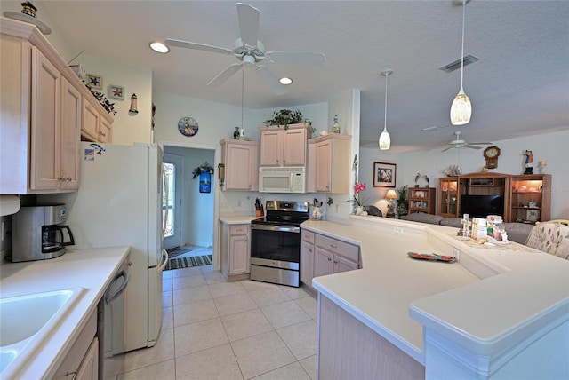 kitchen featuring visible vents, ceiling fan, appliances with stainless steel finishes, open floor plan, and a peninsula