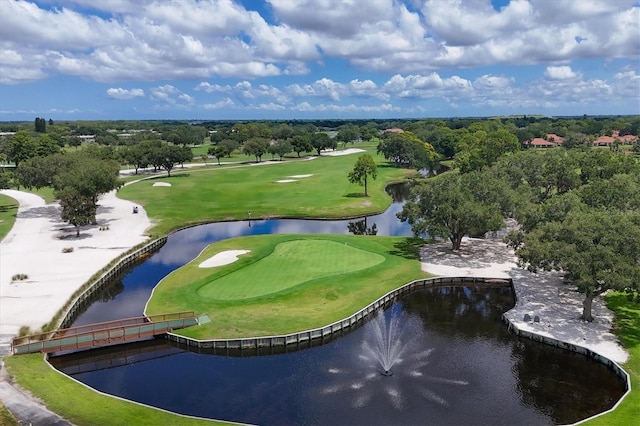 drone / aerial view featuring a water view and golf course view