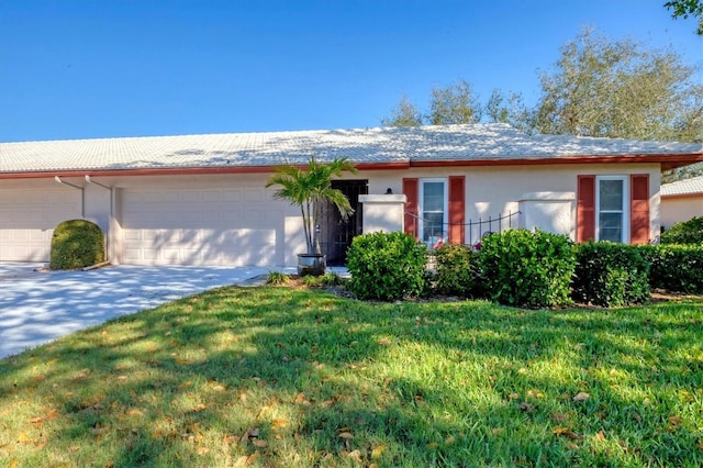 ranch-style house with a garage, driveway, a front lawn, and stucco siding