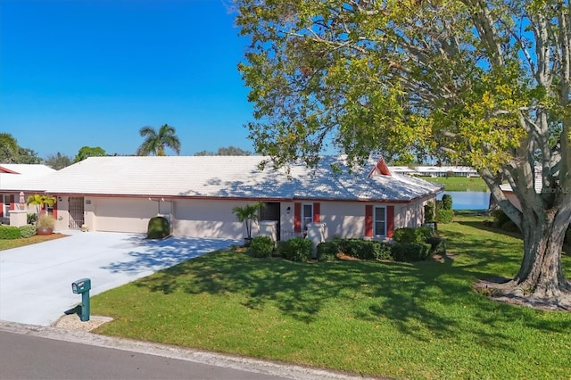 single story home featuring a garage, concrete driveway, and a front lawn