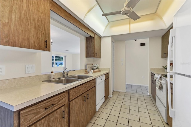 kitchen featuring light tile patterned floors, ceiling fan, white appliances, a sink, and light countertops