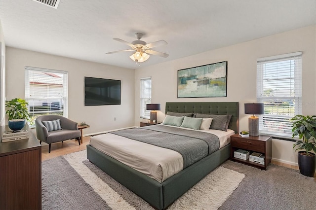 bedroom featuring baseboards and a ceiling fan