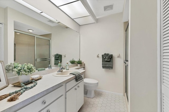 bathroom featuring a stall shower, visible vents, toilet, tile patterned flooring, and vanity