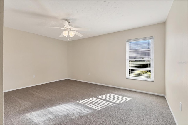 unfurnished room featuring ceiling fan, baseboards, and carpet flooring