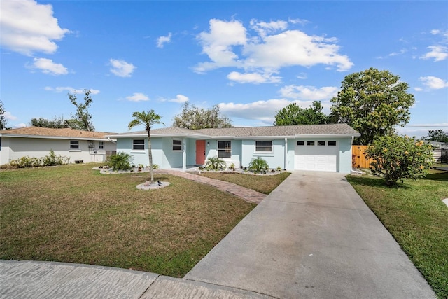 single story home with a garage, fence, driveway, stucco siding, and a front yard