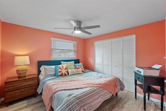 bedroom featuring a closet, ceiling fan, and wood finished floors