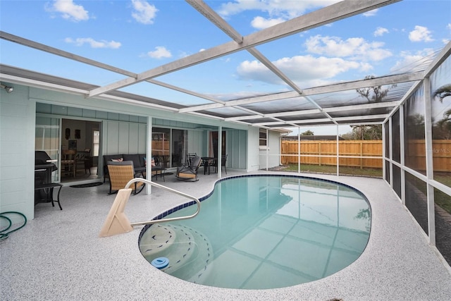 view of swimming pool with a fenced in pool, a lanai, a patio, and fence