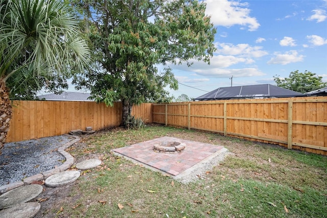 view of yard featuring an outdoor fire pit and a fenced backyard