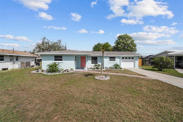 ranch-style home with a garage, driveway, and a front lawn