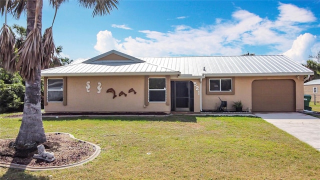 view of front of house featuring metal roof, an attached garage, concrete driveway, stucco siding, and a front lawn