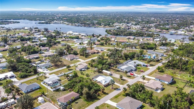 bird's eye view featuring a residential view and a water view