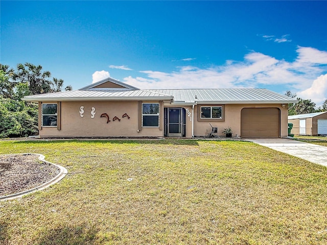 single story home with driveway, metal roof, a front lawn, and stucco siding