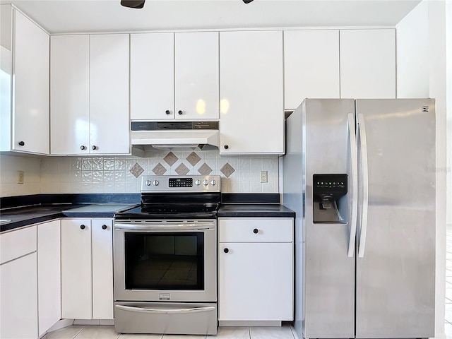 kitchen featuring under cabinet range hood, white cabinetry, and stainless steel appliances