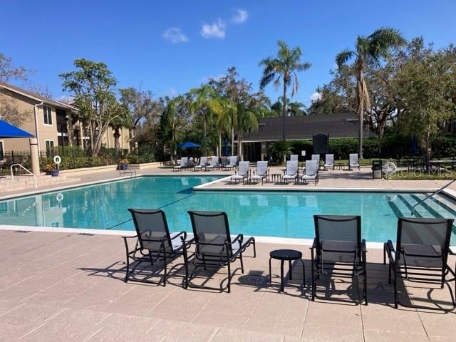 pool with a patio